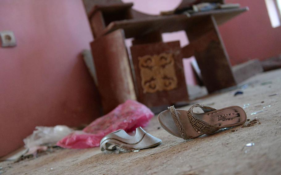 Shoes, broken glass and other debris litter the floor of a Kabul house on Oct. 8, 2017, after a U.S. missile struck it by mistake more than a week before.