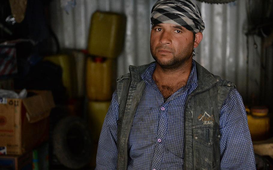 Tamim, who like many Afghans uses just one name, stands in his workshop on Oct. 8, 2017. He was in his workshop more than a week before when he heard a U.S. missile hit his family home a short distance a way, injuring several of his family members.