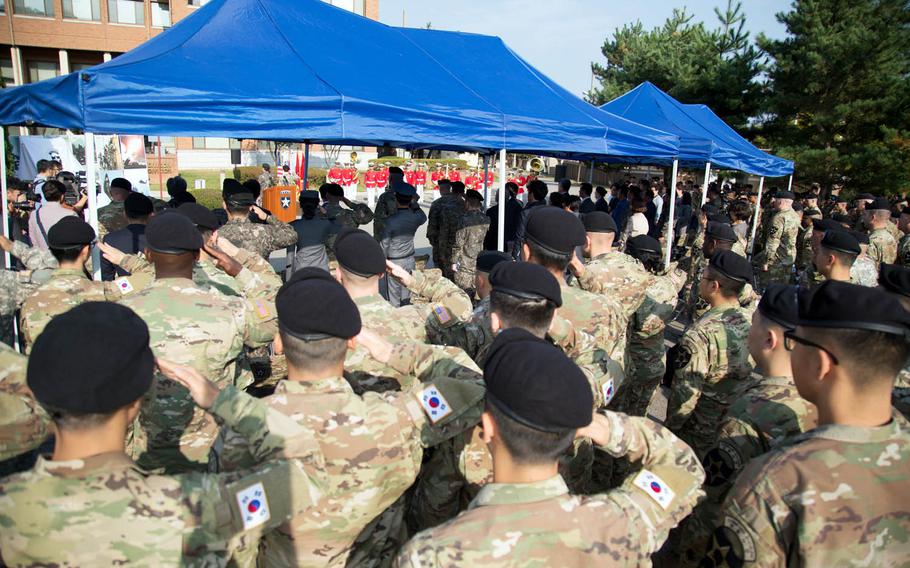 U.S. and South Korean soldiers assigned to the 2nd Infantry Division salute during a ceremony at Camp Red Cloud, South Korea, Monday, Oct. 16, 2017.
