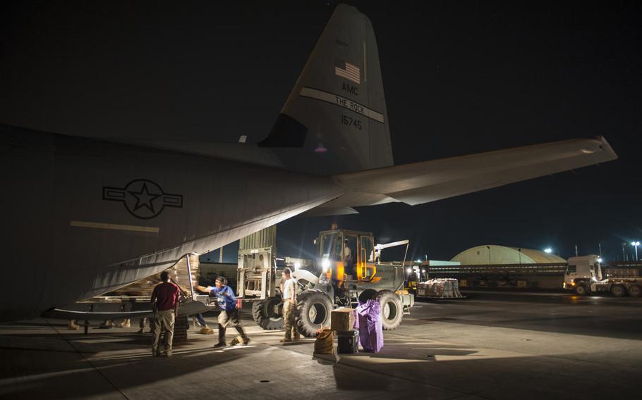 Airmen from the 449th Air Expeditionary Group load cargo onto a C-130 plane for a Combined Joint Task Force-Horn of Africa mission in Somalia, May 26, 2017.