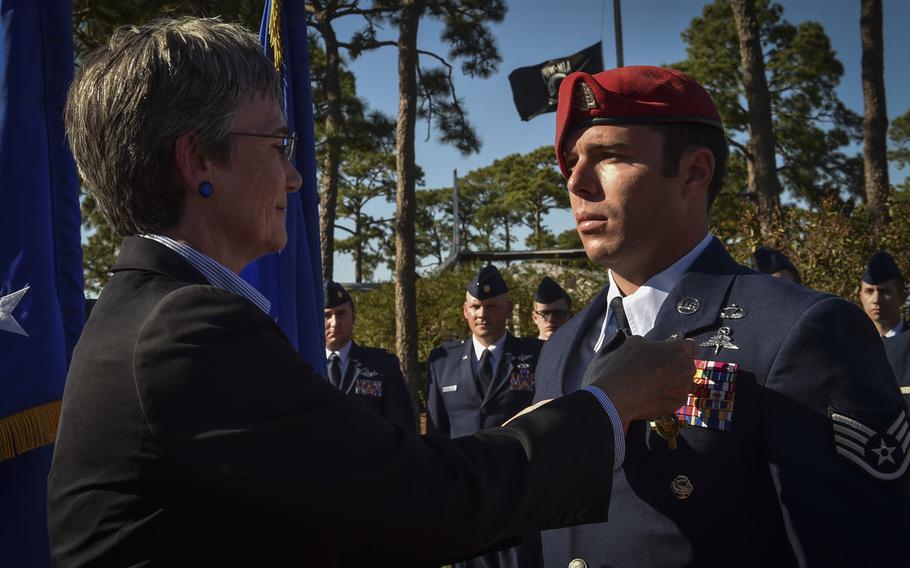 Secretary of the Air Force, Heather Wilson, pins the Air Force Cross on Staff Sgt. Richard Hunter, a Special Tactics Airman with the 23rd Special Tactics Squadron, during a combined medal ceremony at Hurlburt Field, Fla., Tuesday, Oct. 17, 2017.