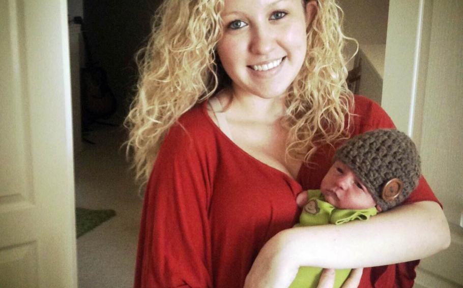 Katie Whiddon poses with her son, Camden, when he was a newborn.