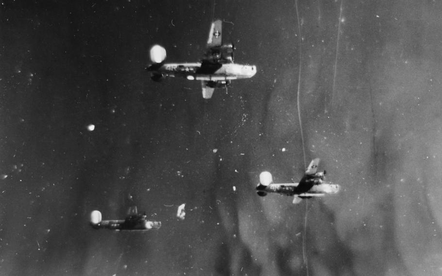 Three B-24 Liberators from the 844th Bomb Squadron, 489th Bomb Group fly in formation: Ford's Folly, top; Plucky Lady, right; and Bomber's Moon, left. Bomber's Moon crashed near Edenkoben, Germany with the loss of seven lives during a raid on Oct. 19, 1944. The bomber Pregnant Peggy got caught up in the prop wash of another aircraft, lost control and knocked off the Bomber's Moon tail section. On Oct. 19, 2017, family members of the Pregnant Peggy crew came to the crash site to dedicate a memorial to the lost men of both crews.
