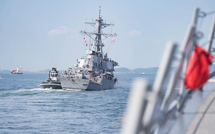The guided-missile destroyer USS Fitzgerald returns to Yokosuka Naval Base after a collision with a merchant vessel off Japan.