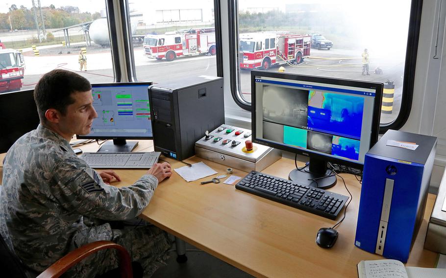 Staff Sgt. Alberto Garcia-Vidal monitors other firefighters in a burn house by computer during training on Ramstein Air Base, Germany on Tuesday, Oct. 24, 2017. Garcia-Vidal distinguished himself recently as one of a group of 145 Red Cross volunteers who helped man a call center for victims of Hurricane Maria.