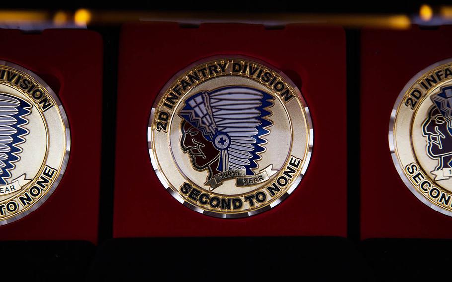 A 100th anniversary challenge coin for the 2nd Infantry Division is displayed at Camp Casey, South Korea, Thursday, Oct. 26, 2017.