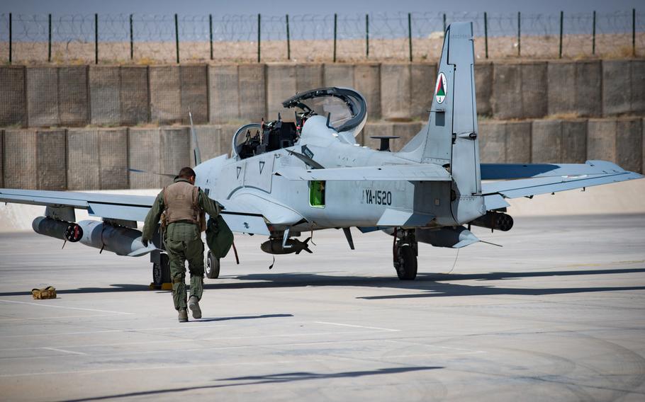 An Afghan A-29 pilot walks toward his aircraft at Kandahar Airfield, Afghanistan, Sept. 10, 2017. The Afghan Air Force plans and conducts all A-29 combat missions throughout Afghanistan.