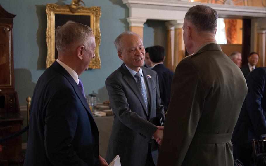 Defense Secretary Jim Mattis, left, and Marine Corps Gen. Joseph Dunford, chairman of the Joint Chiefs of Staff, speak with Chinese Ambassador to the U.S. Cui Tiankai at the State Department in Washington, D.C., June 21, 2017.
