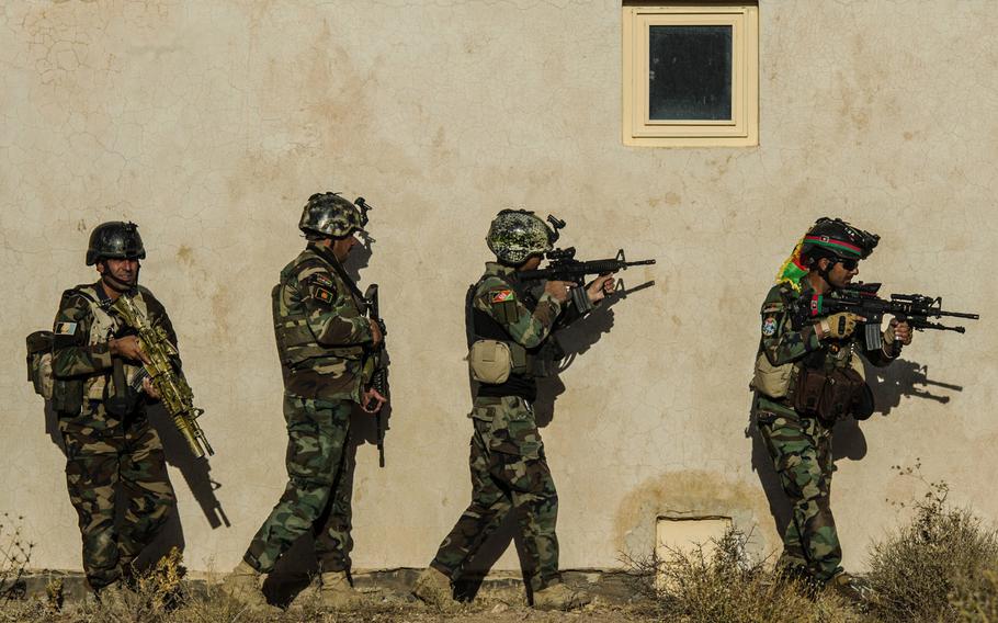 A team of Afghan Special Security soldiers close in on a compound during a close quarters combat exercise at Herat, Afghanistan, on Oct. 14, 2017.