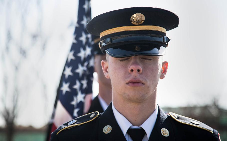 A  color guard member prepares to march into a Veterans Day ceremony at Camp Humphreys, South Korea, Saturday, Nov. 11, 2017.