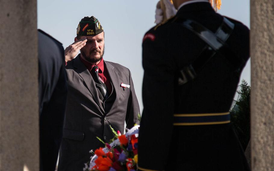 Veteran Jerry Oliver salutes during a Veterans Day ceremony at Camp Humphreys, South Korea, Saturday, Nov. 11, 2017.