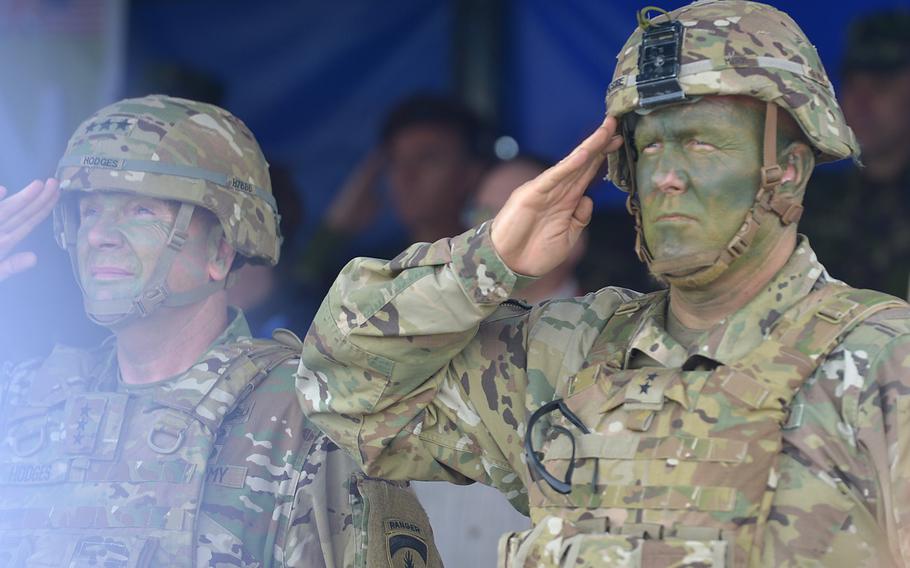 Maj. Gen. Timothy McGuire, U.S. Army Europe deputy commander, right, stands next to Lt. Gen. Ben Hodges, USAREUR commander during a ceremony at the conclusion of a live-fire exercise during Saber Guardian in Romania, July 15, 2017. 