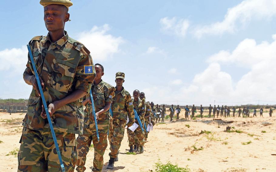 Somali government soldiers demonstrate field tactics during a ceremony at the end of a light infantry training course. It was conducted by the European Union Training Mission at the General Dhagabadan Training Camp in Mogadishu in September 2017.