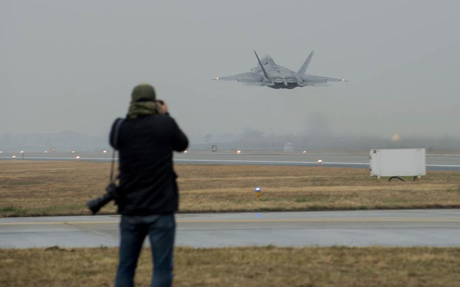 An F-22 Raptor from Joint Base Elmendorf-Richardson, Alaska, takes off from Gwangju Air Base, South Korea, Monday, Dec. 4, 2017.