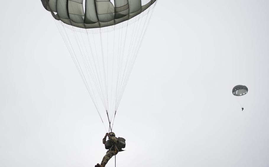 Paratroopers land near Alzey, Germany, on Wednesday, Dec. 6, 2017.