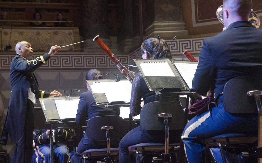 Lt. Col. Dwayne Milburn, left, commander and conductor of the U.S. Army Europe band and chorus, leads the band in a rendition of "Fantasia in G" during a Christmas concert at the Kurhaus in Wiesbaden, Germany, Wednesday, Dec. 6, 2017. The band will play two more dates in its Christmas series, with performances in Pforzheim Dec. 7 and Grafenwoehr Dec. 8.