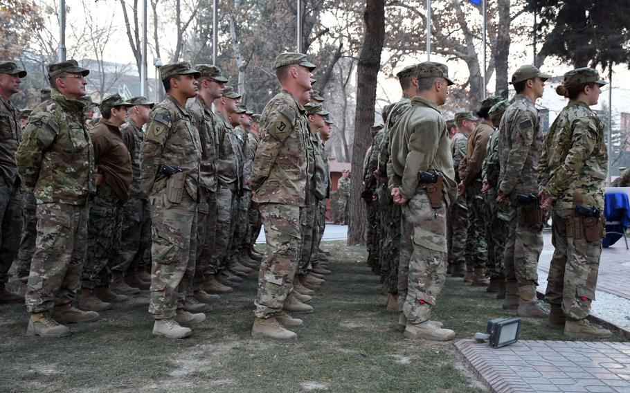 U.S. and coalition troops attend a ceremony at NATO's Resolute Support headquarters in Kabul on Thursday, Dec. 7, 2017, to mark the 76th anniversary of the attack on Pearl Harbor.