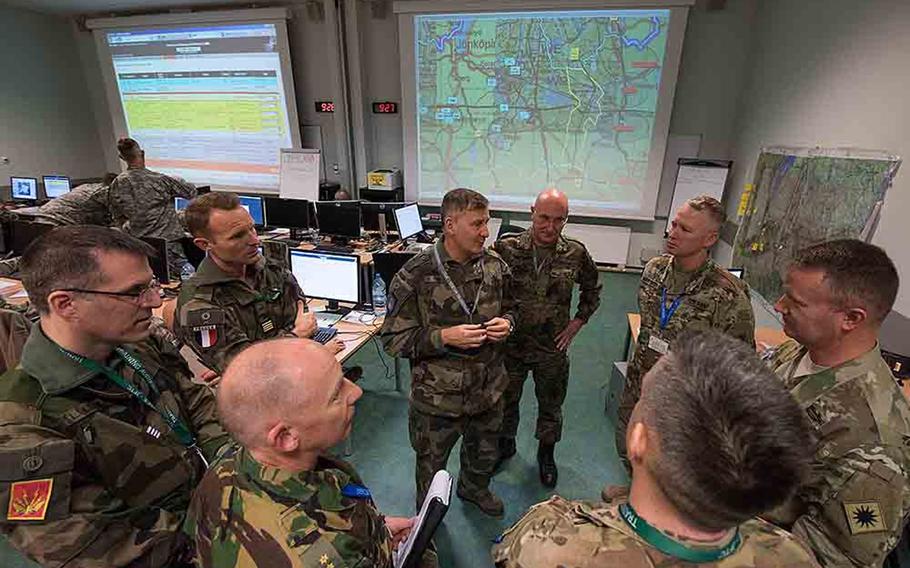 California National Guardsmen with the 40th Infantry Division work with French Rapid Reaction Corps soldiers during the opening of the Citadel Bonus mission in Bydgoszcz, Poland on Thursday, Dec. 7, 2017.