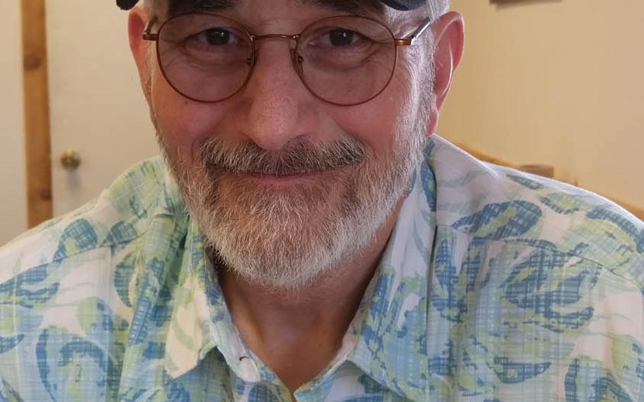Vietnam veteran and poet John Musgrave wears a Purple Heart cap in this photo taken in July. After being shot in the face and chest in November 1967, sustaining life-threatening and permanently disabling injuries, Musgrave overcame severe post-traumatic stress and now helps to counsel post-911 veterans. 
Photo courtesy of John Musgrave