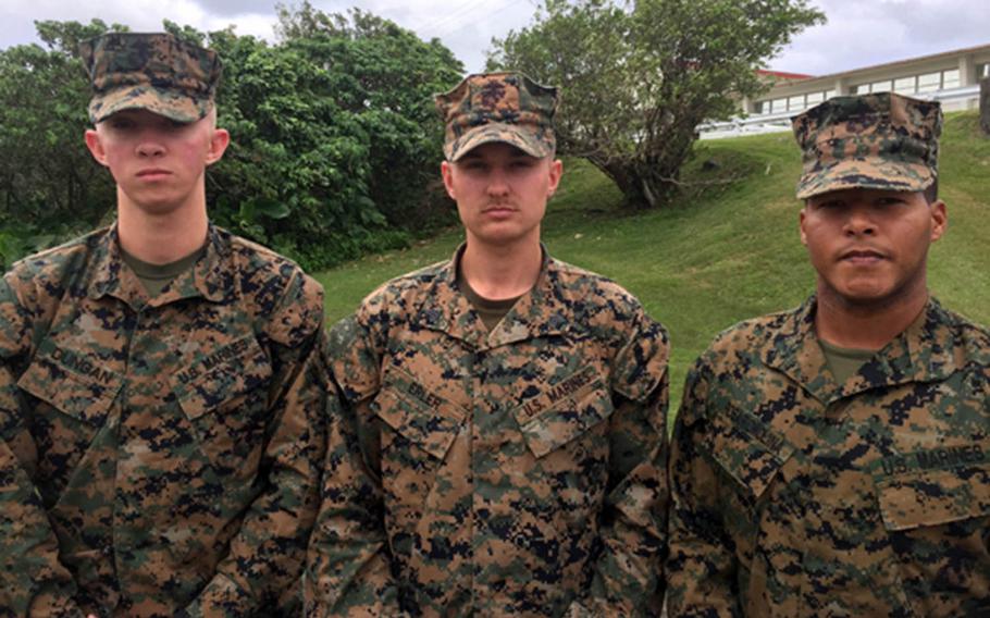 Cpl. Matthew Dungan, from left, Sgt. Justin Erler and Lance Cpl. Eduardo Rosario have been credited with saving the life of a fellow Marine who was struck by a car on the Okinawa Expressway, Dec. 1, 2017.
