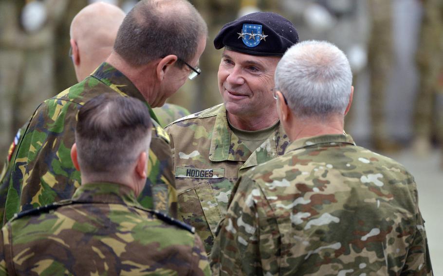 Lt. Gen. Ben Hodges, the outgoing commander of U.S. Army Europe talks with officers from other militaries before his relinquishment of command and retirement ceremony at Clay Kaserne in Wiesbaden, Germany, Friday, Dec. 15, 2017.