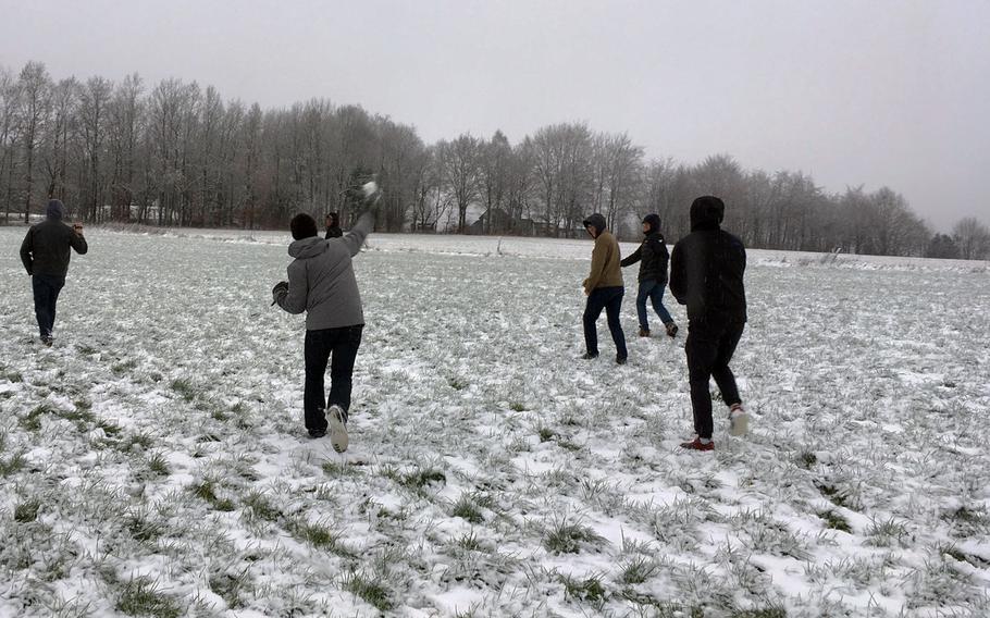 Soldiers from the Grafenwoehr Training Area have a snowball fight at a Battle of the Bulge battlefield, Saturday, Dec. 16, 2017.