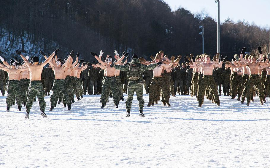 U.S. and South Korean Marines get airborne during a short workout at Pyeongchang, South Korea, Tuesday, Dec. 19, 2017.