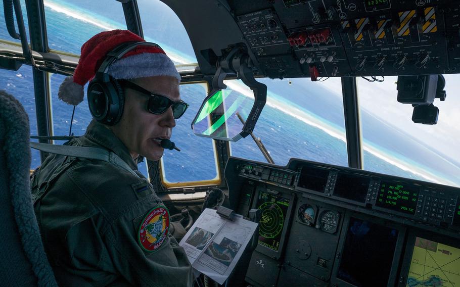 First Lt. Quinn Van Drew, a C-130J Super Hercules pilot assigned to the 36th Airlift Squadron, flies above Murilo Atoll, Chuuk, during Operation Christmas Drop, Dec. 15, 2017.