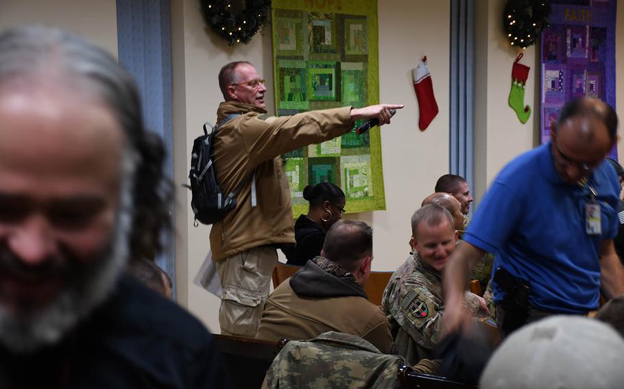 Bill Ripley, general manager for AAFES in Afghanistan, calls on a soldier during a trivia game before a screening of "Star Wars: The Last Jedi" at a base on Kabul's international airport on Saturday, Dec. 23, 2017.