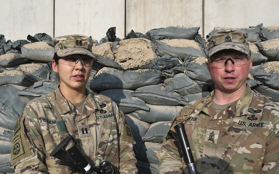 Capt. Danielle Villanueva and First Sgt. Roman Pavlyuk of Alpha Company, 127th Airborne Engineering Company, 1st Battalion Combat Team, 82nd Airborne Division, are pictured here on Wednesday, Dec. 20, 2017.