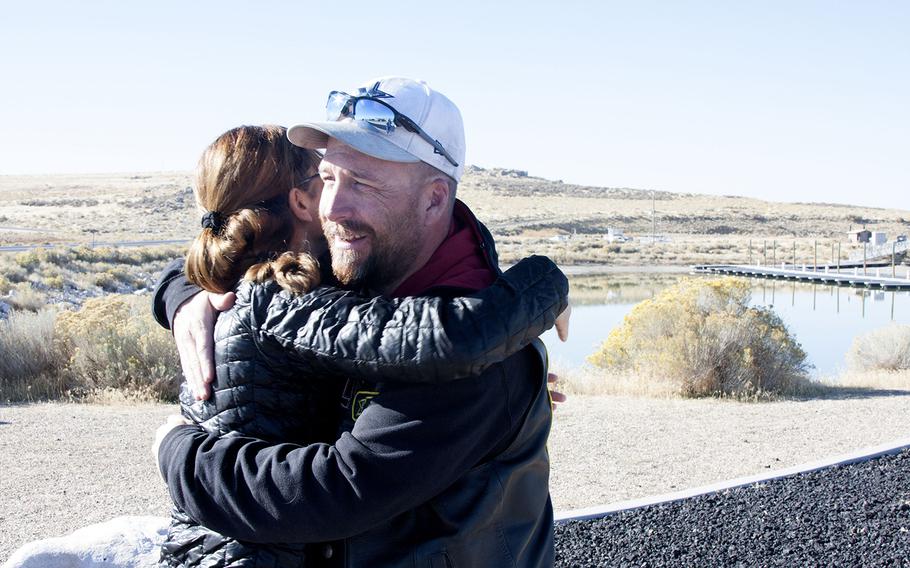 Veteran and psychologist Annabelle Bryan hugs Kelley Bunten, a member of the Combat Veterans Motorcycle Association, on Saturday, Oct. 28 at Antelope Island State Park in Utah. The association raised $35,000 through their Ride to Zero initiative for the National Center for Veterans Studies to help fund suicide-prevention efforts.