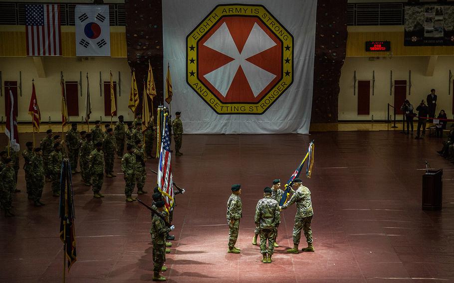 In his final act as 8th Army commander, Lt. Gen. Thomas Vandal passes the unit's colors at Camp Humphreys, South Korea, Friday, Jan. 5, 2018.