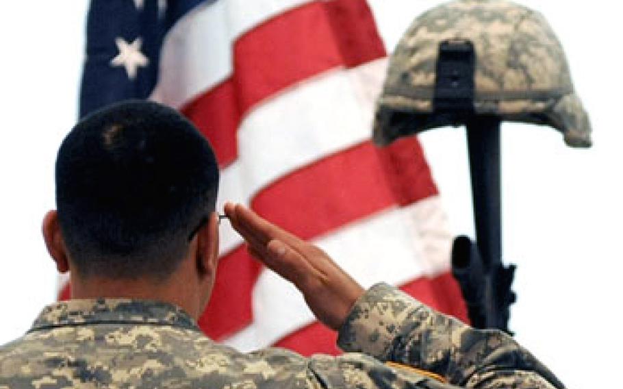 A comrade gives a final salute at a memorial service in 2009. The Army is investigating the death of a U.S. soldier who died Saturday while serving as part of NATO's peacekeeping force in Kosovo.
