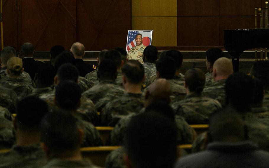 A portrait of Staff Sgt. Kyle LeFlore overlooks his former comrades during a ceremony at Camp Humphreys, South Korea, Thursday, Jan. 11, 2018.