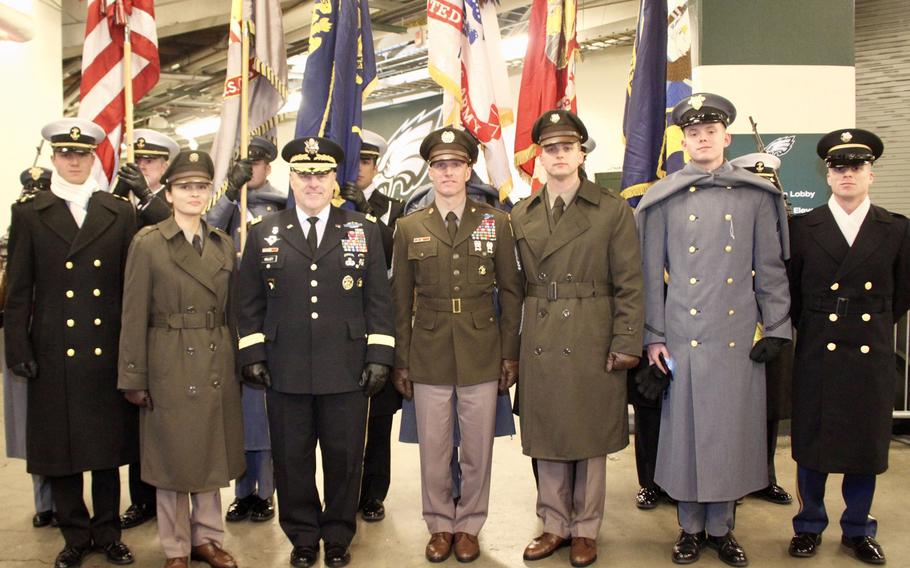 Army Chief of Staff General Mark Milley stands with Sergeant Major of the Army Dan Dailey prior to walking out onto the field for the beginning of the Army-Navy game in Philadelphia, December 9, 2017. Standing with them in front of the games color guard were soldier models who along with the SMA are wearing the proposed Pink & Green daily service uniform.