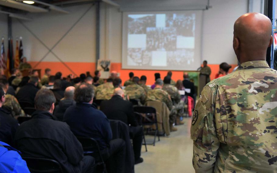 Equal opportunity leader Sgt. 1st Class Rashaad Liban listens as soldiers speak about the civil rights movement at an event marking the birthday of Martin Luther King Jr., Vilseck, Germany, Thursday, Jan. 11, 2017.