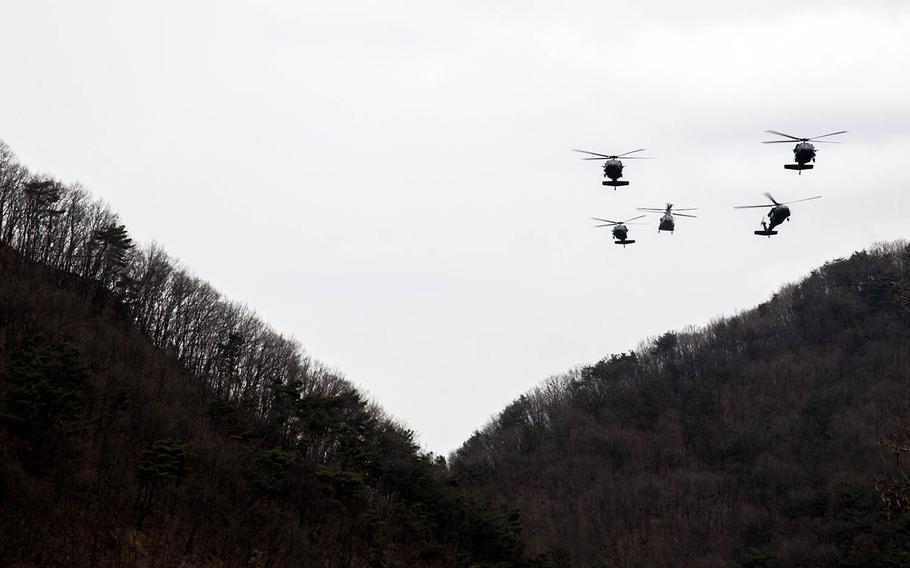 Army helicopters fly over Rodriguez Live Fire Range in Paju, South Korea, Tuesday, March 21, 2017.