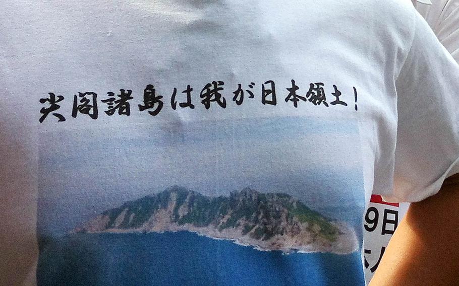 A man wears a T-shirt that says the Senkakus belong to Japan, during a past demonstration over the disputed East China Sea islands.
