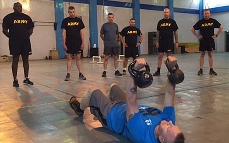 Army Command Sgt. Maj. John Wayne Troxell, the senior enlisted advisor to the chairman of the Joint Chiefs of Staff, leads an intense, early morning workout session at Resolute Support headquarters in Kabul, Afghanistan, July 17, 2016.