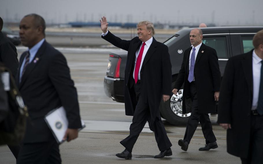 President Donald Trump waves to the crowd as he arrives at Roland R. Wright Air National Guard Base in Salt Lake City, Utah, on Dec. 4, 2017.