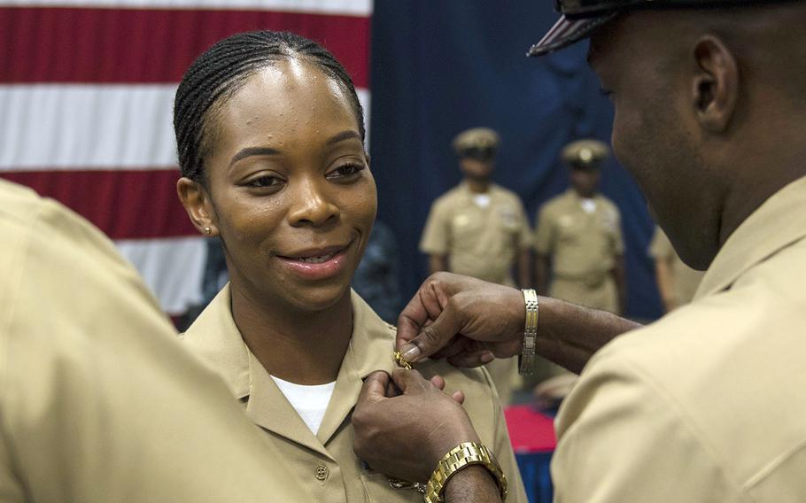 A sailor is promoted to the rank of chief petty officer during a pinning ceremony aboard the USS Iwo Jima, Sept. 16, 2017.