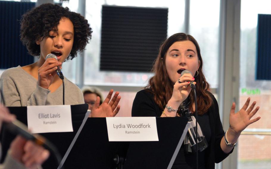 Ramstein's Lydia Woodfork, left, and Stuttgart's Olivia Schmitz, the vocal ensemble's altos, belt out a number during rehearsals at the DODEA-Europe jazz seminar in Ramstein, Germany, Tuesday, Jan. 16, 2018.