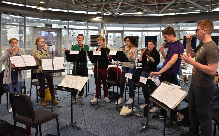 The jazz vocal ensemble rehearse a song at this year's DODEA-Europe jazz seminar in Ramstein, Germany, Tuesday, Jan. 16, 2018. From left are Aubrey Armstrong from Stuttgart, Violet Bender from Vilseck, Ramstein's Grady Gallagher, Elliot Lavis and Lydia Woodfork, Stuttgart's Olivia Schmitz, Lakenheath's John Rowberry and Michael Bramhall from Alconbury.