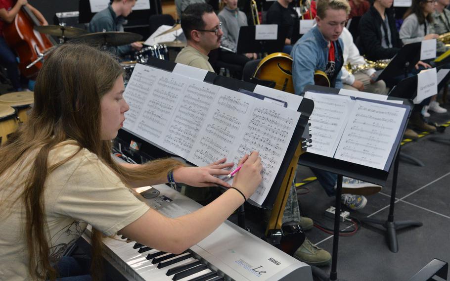 Alyssa Solomon of Naples makes some adjustments to her sheet music during a big band rehearsal at this year's DODEA-Europe jazz seminar in Ramstein, Germany, Tuesday, Jan. 16, 2018.