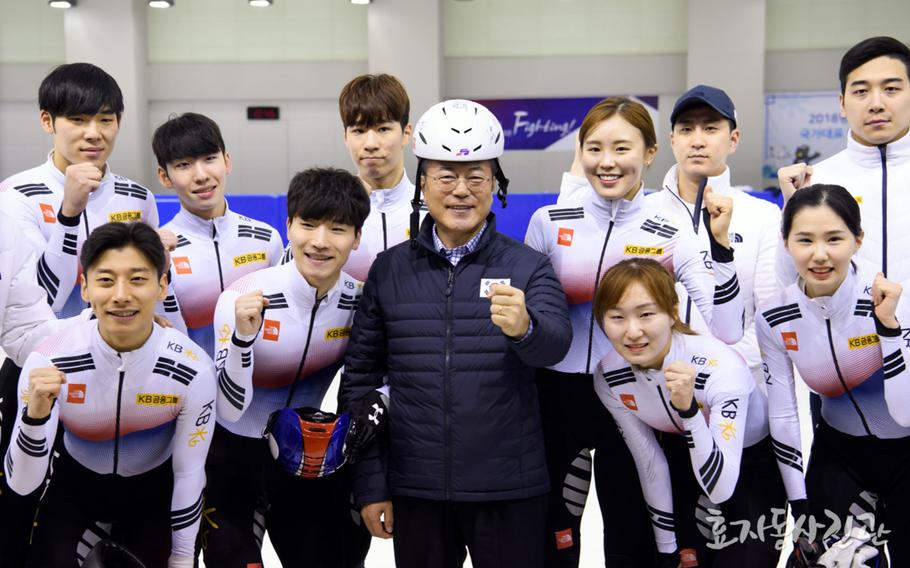 South Korean President Moon Jae-in meets with South Korean athletes at a training center in Jincheon, South Korea, Wednesday, Jan. 17, 2018.