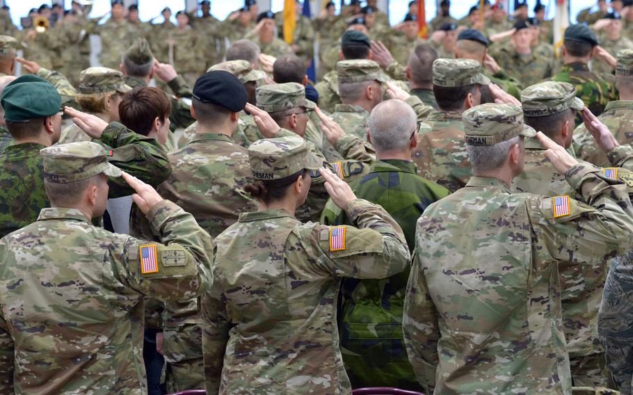 Soldiers salute at the U.S. Army Europe assumption-of-command ceremony at Clay Kaserne in Wiesbaden, Germany, Thursday, Jan. 18, 2018. Lt. Gen. Christopher Cavoli took command of the unit.