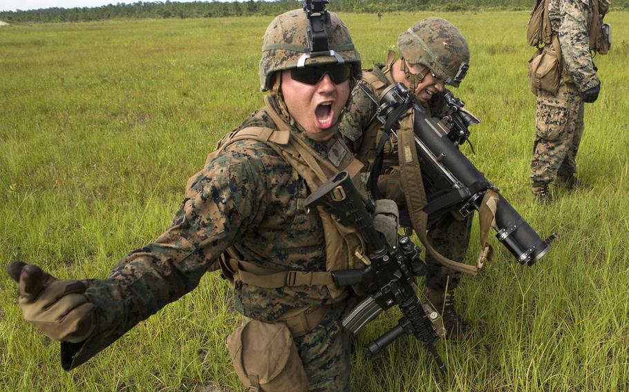 U.S. Marine Corps Lance Cpl. Charlie F. Delrio, infantry assaultman, with 2nd Battalion, 8th Marine Regiment, 2nd Marine Division, calls out commands during a live-fire range  on Camp Lejeune, N.C., June 15, 2017.