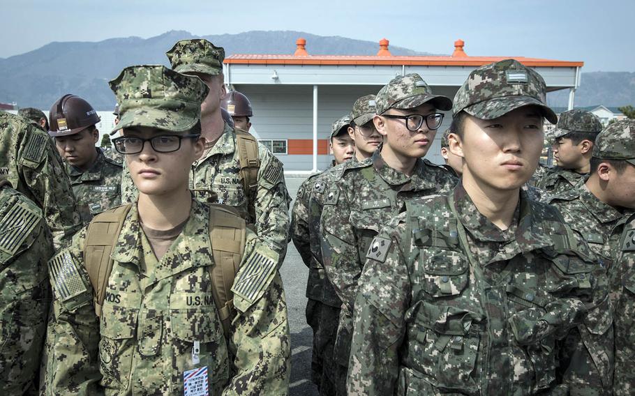 American and South Korean sailors listen to a safety briefing during exercise Foal Eagle in Jinhae, South Korea, March 13, 2017.