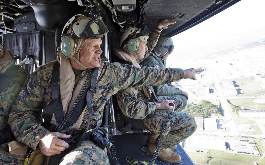Marine Corps Commandant Gen. Robert Neller travels in a UH-1Y Huey during a visit to Okinawa, Japan in 2015.
