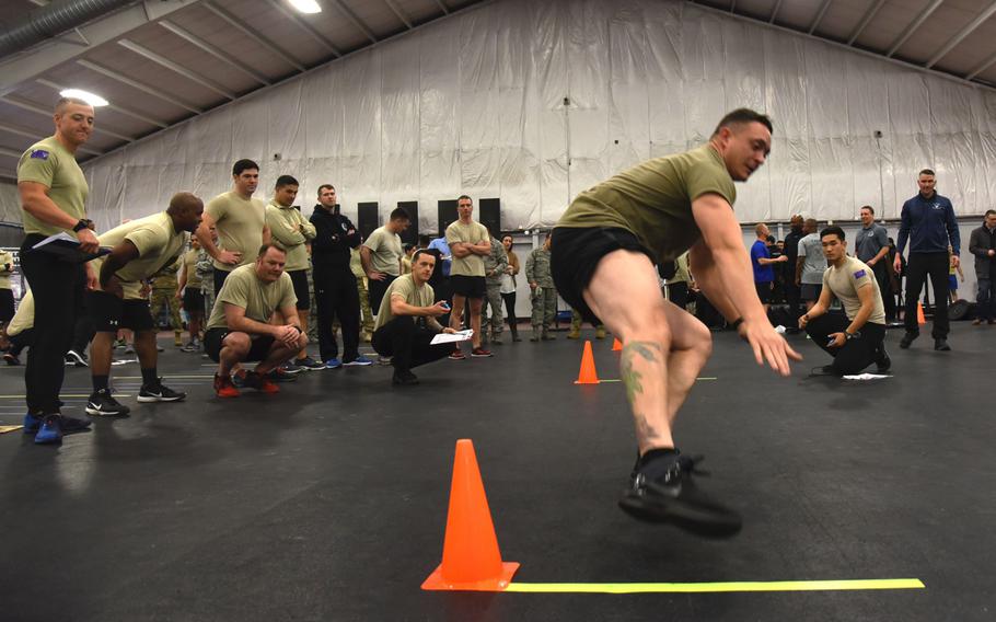 Master Sgt. Kyle Anderson, 3rd Air Support Operations Group, runs between two cones during a speed, strength and agility demonstration at Joint Base Andrews, Md., Tuesday, January 9, 2018. The Air Force began the rollout of Tier 2 physical training standards as more than 100 battlefield Airmen demonstrated new career field specific testing components.